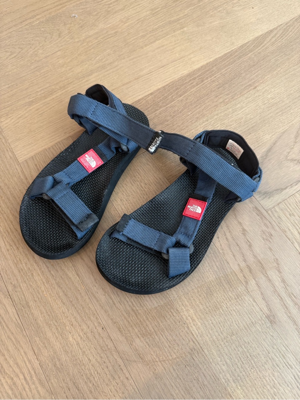 The North Face Youth Navy Blue Adjustable Strap Sandals with Red Logo